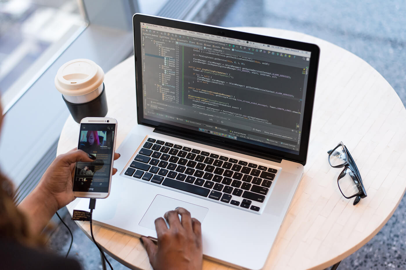 Developer writing code on a laptop